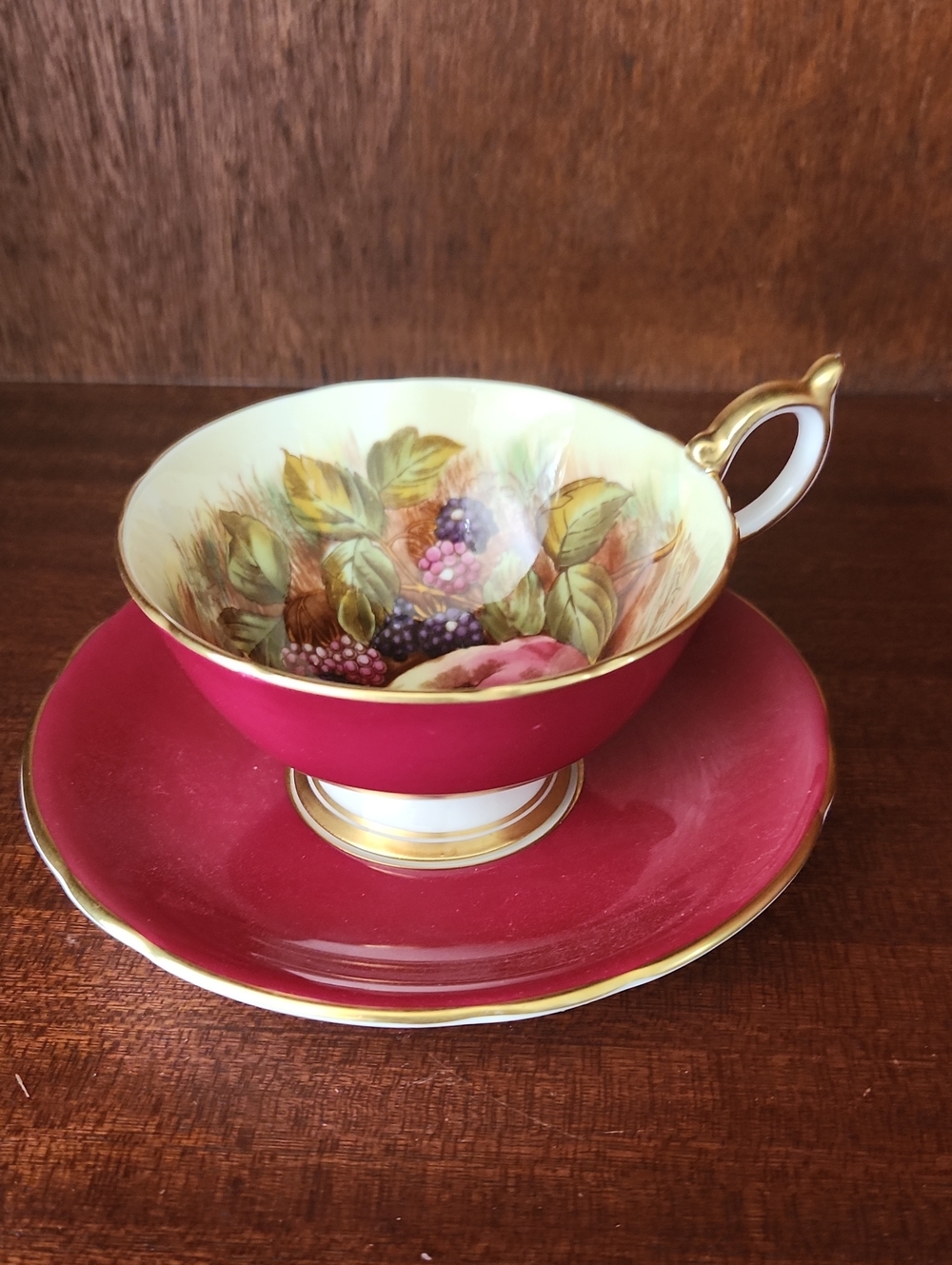 Red/Radpberry Coloured Teacup and Saucer with Gold Trim